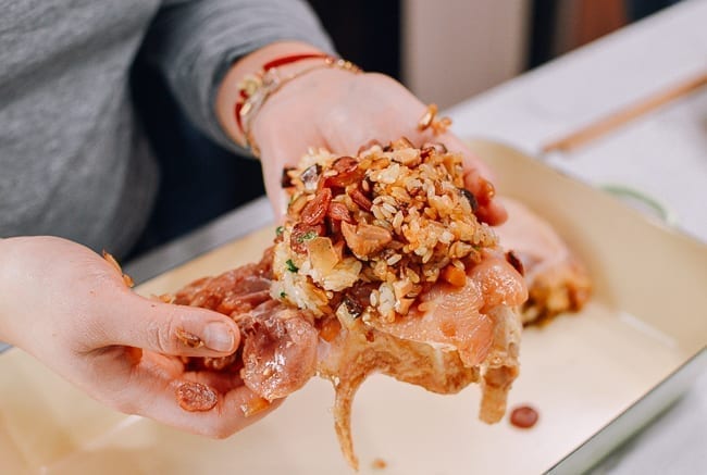 Wrapping Chicken Thighs around sticky rice, thewoksoflife.com