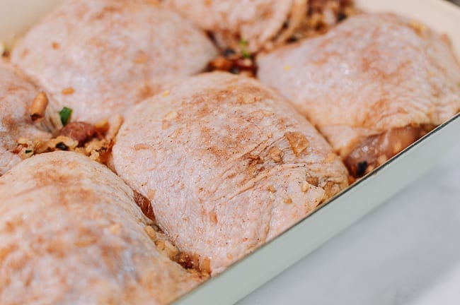 Chicken thighs in baking dish, sprinkled with five spice salt, thewoksoflife.com