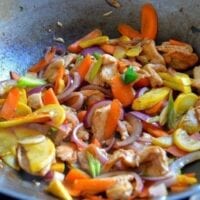 Chicken and mixed vegetables in wok