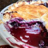 blueberry pie with slice cut out
