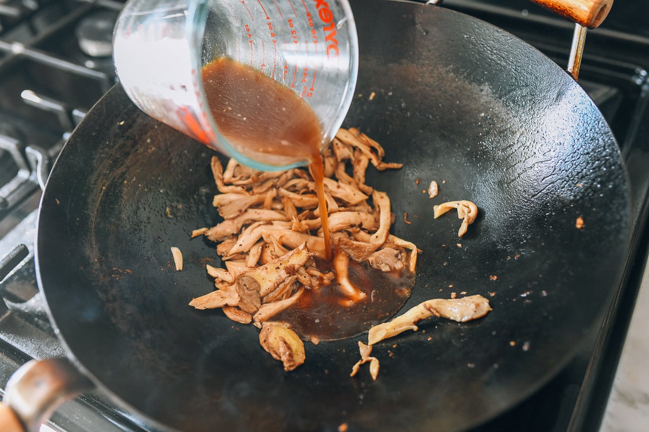 Adding sauce mixture to mushrooms