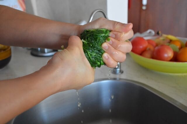 wringing water out of blanched vegetable