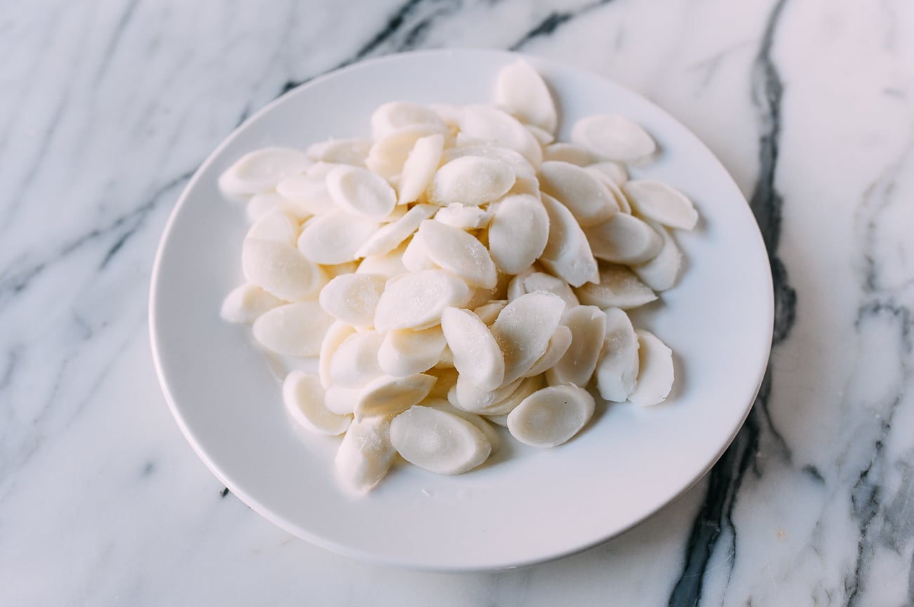 Frozen Chinese rice cake ovals on white plate