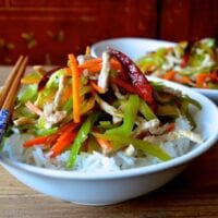 Bowl of Pork and vegetable stir-fry over rice