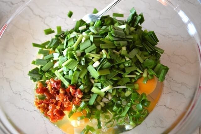 Chinese Chive Frittata with Tomatoes by thewoksoflife.com