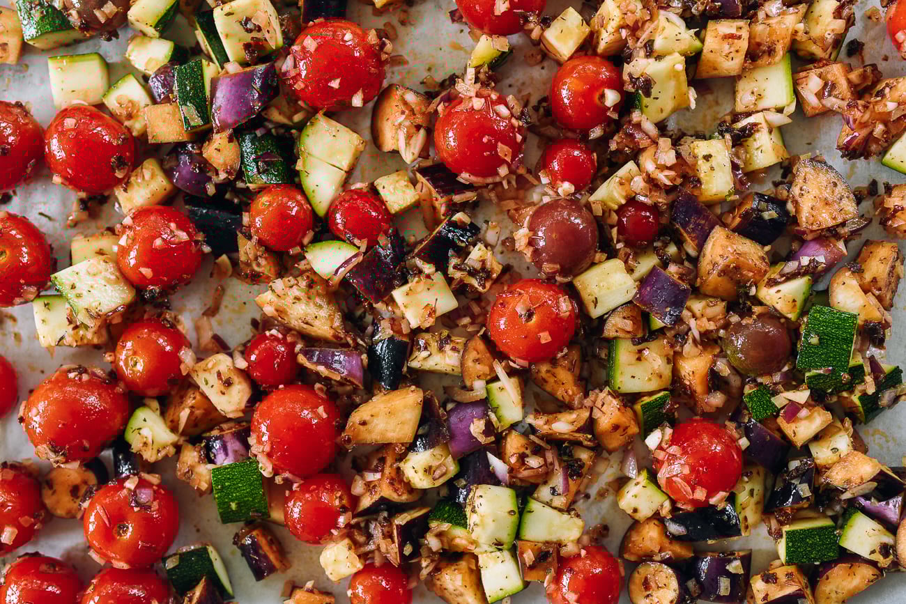 raw summer vegetables on sheet pan for roasting