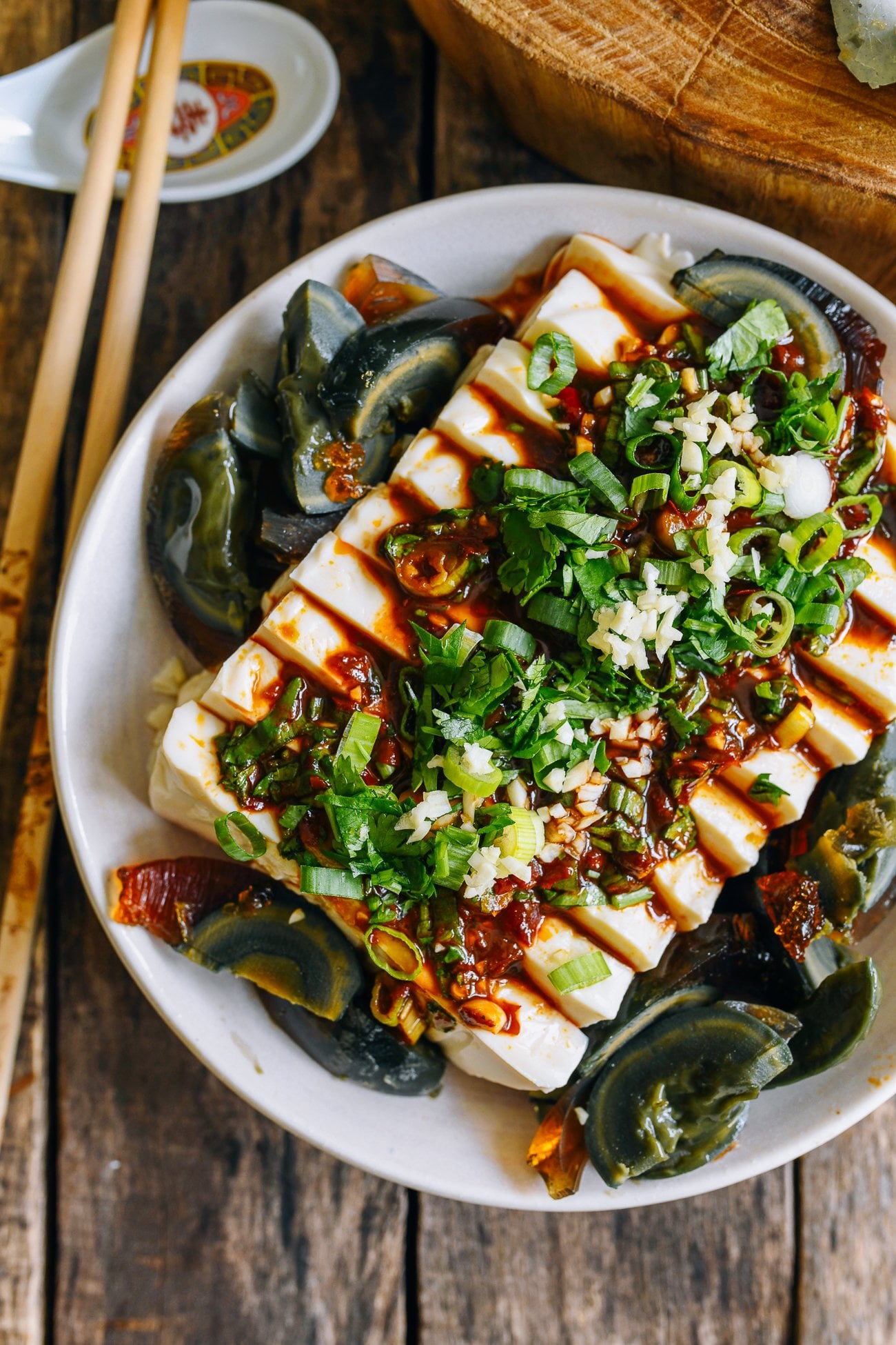 spicy cold tofu with thousand year old egg, cilantro, scallions, garlic