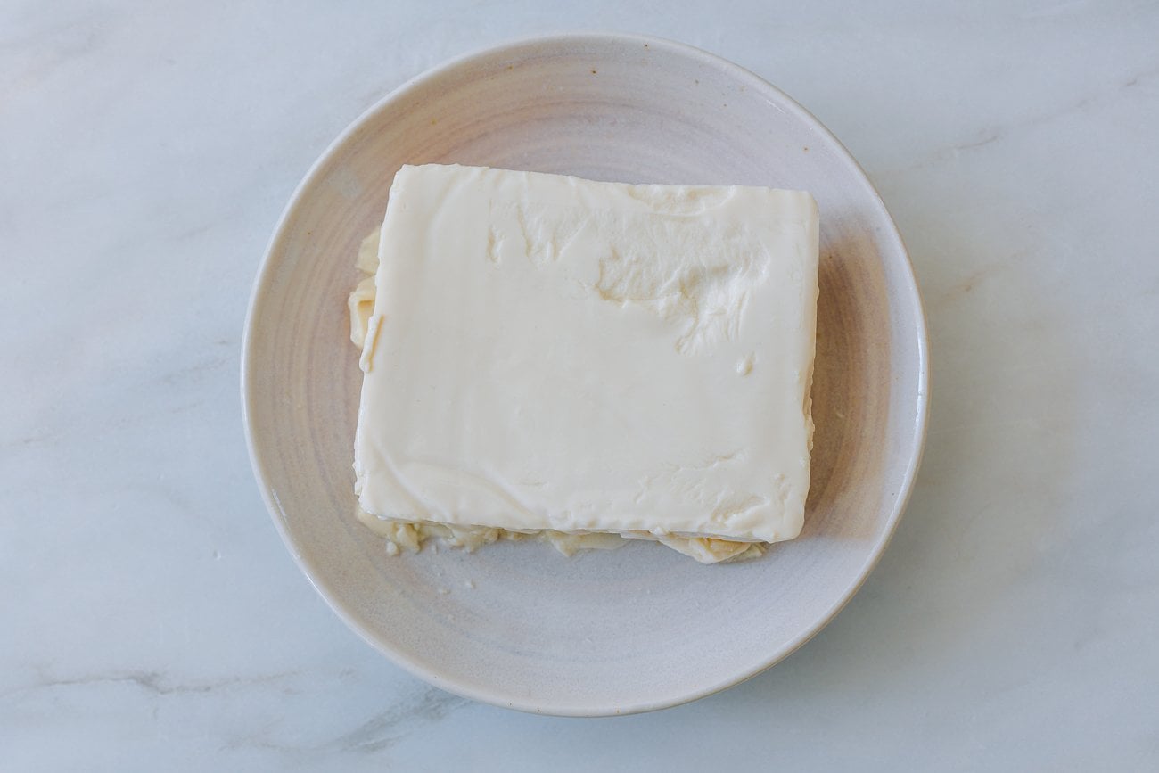 block of tofu on shallow dish