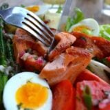 Knife and fork in salmon salad