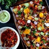 Huevos rancheros nachos with avocado crema and salsa