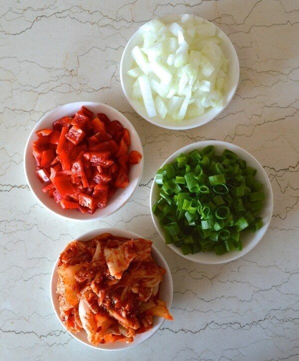 Chopped onions, bell pepper, scallion, and kimchi