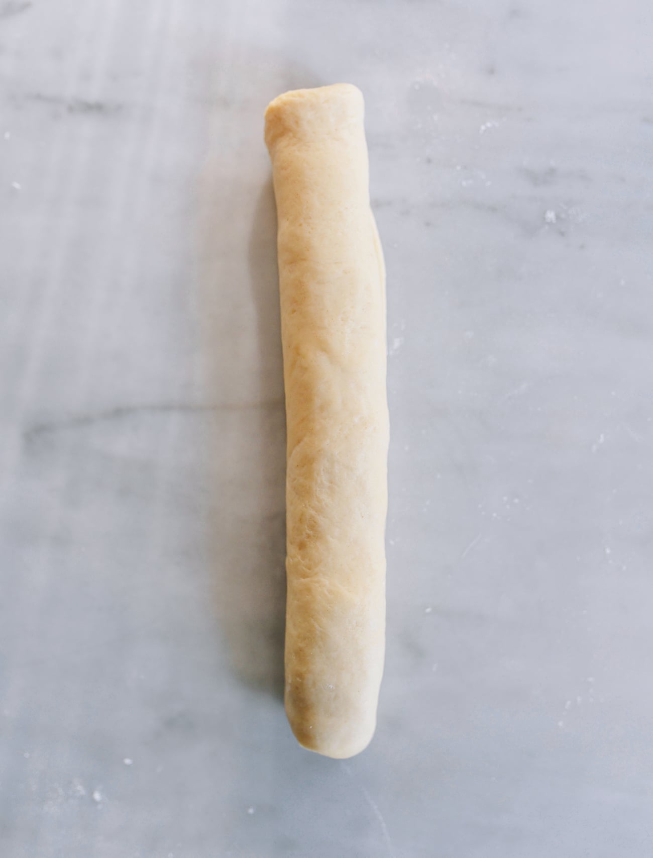Rolled cigar of dough