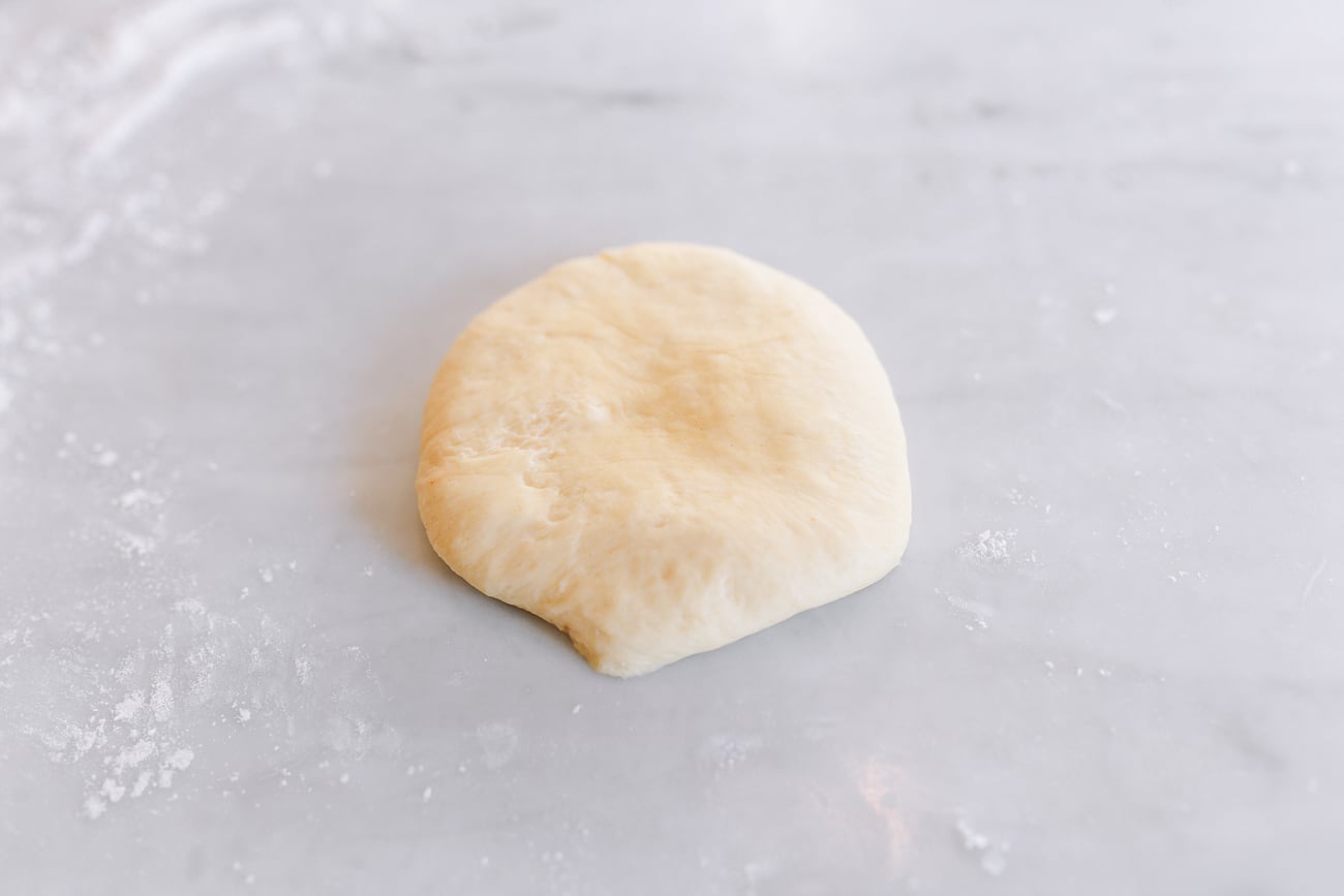 Even dough disc before shaping