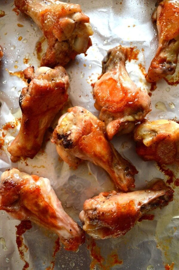 Roasted chicken wings on baking sheet