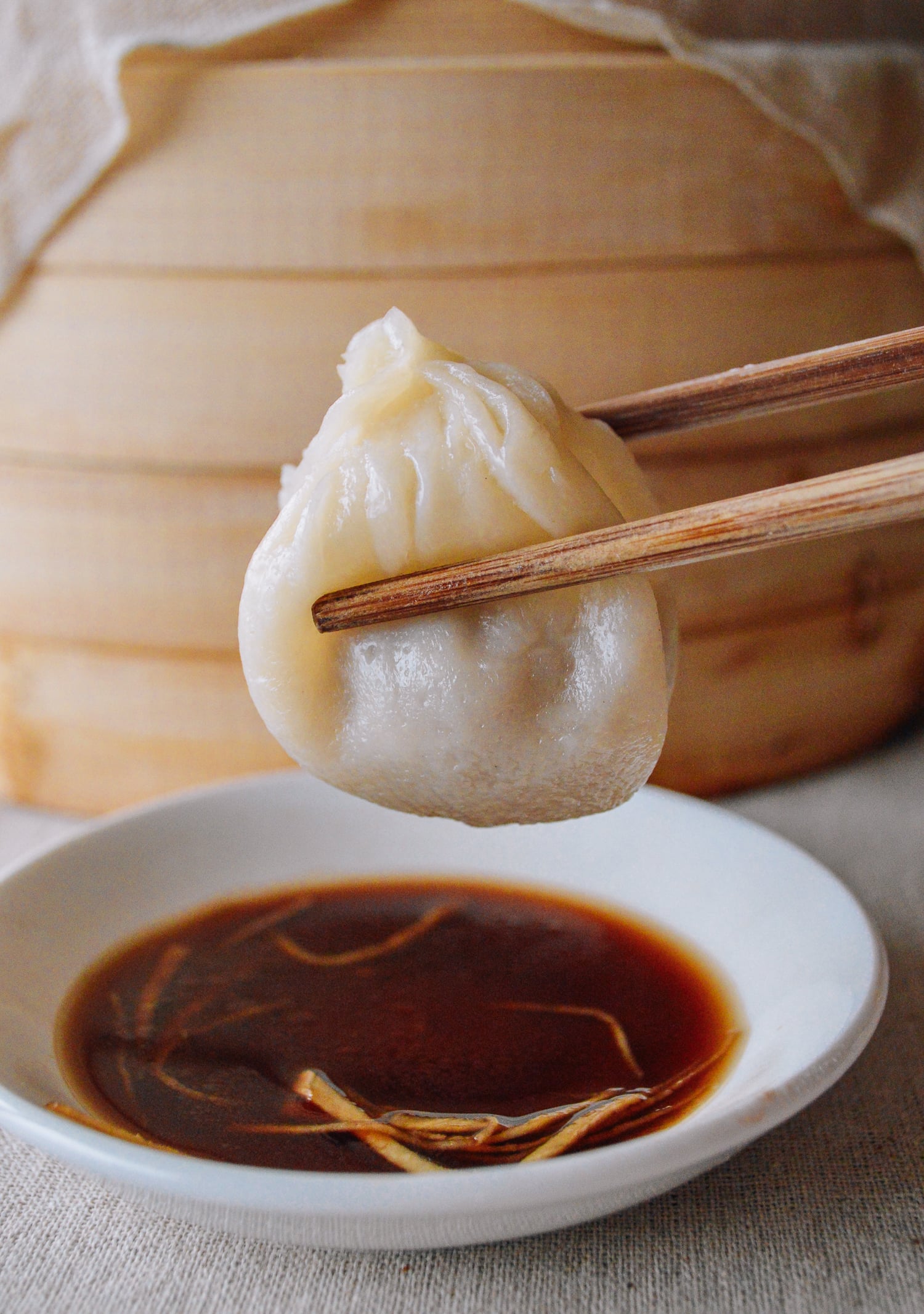 Chinese soup dumpling AKA xiaolongbao and vinegar, by thewoksoflife.com