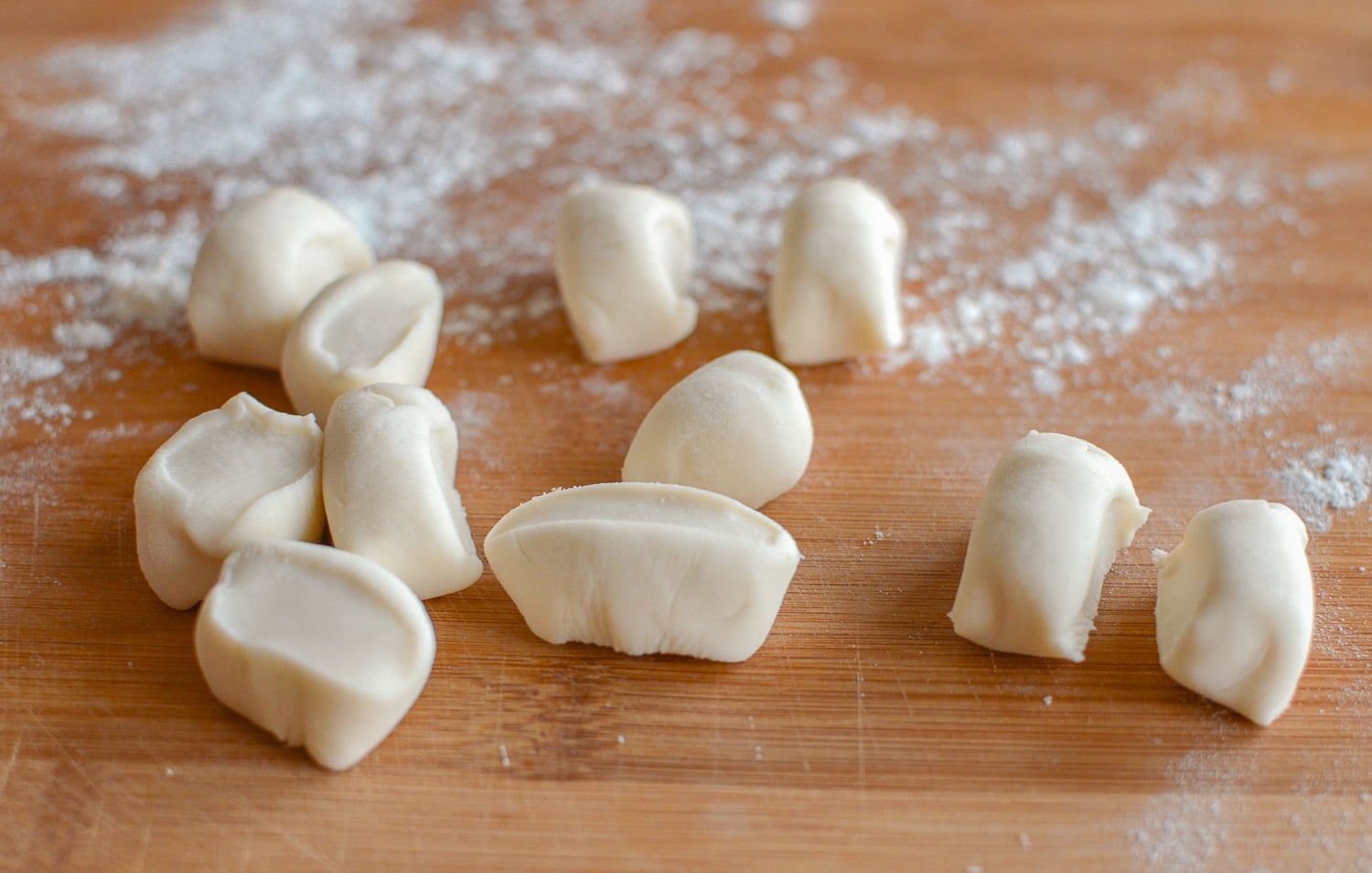 Dumpling wrapper dough cut into small pieces, by thewoksoflife.com