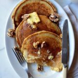 Apple cider pancakes with butter and walnuts