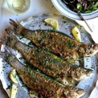 Lemon soy roasted branzino with salad and white wine