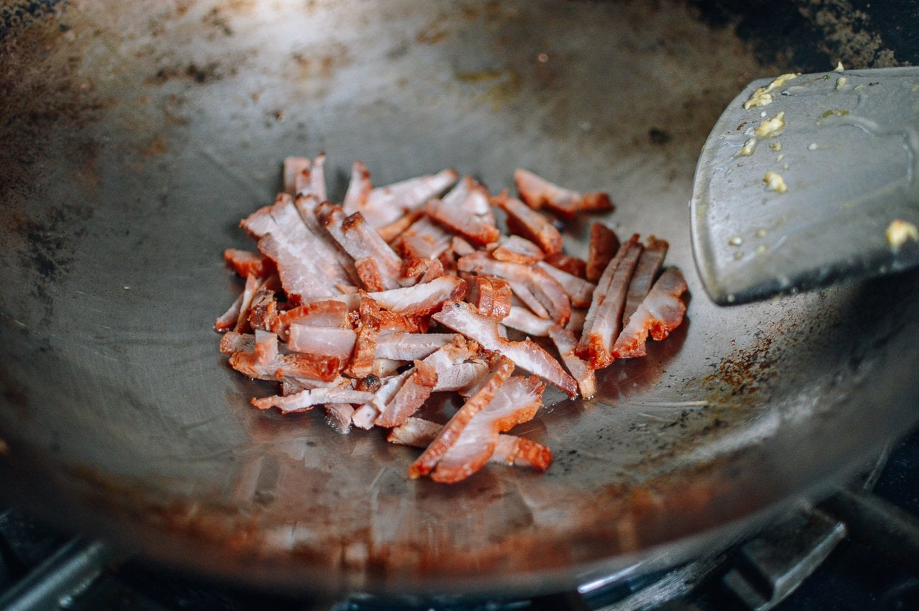 sliced char siu in wok