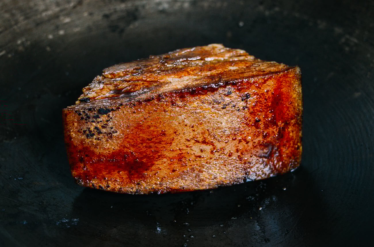 seared hunk of pork belly with dark soy sauce