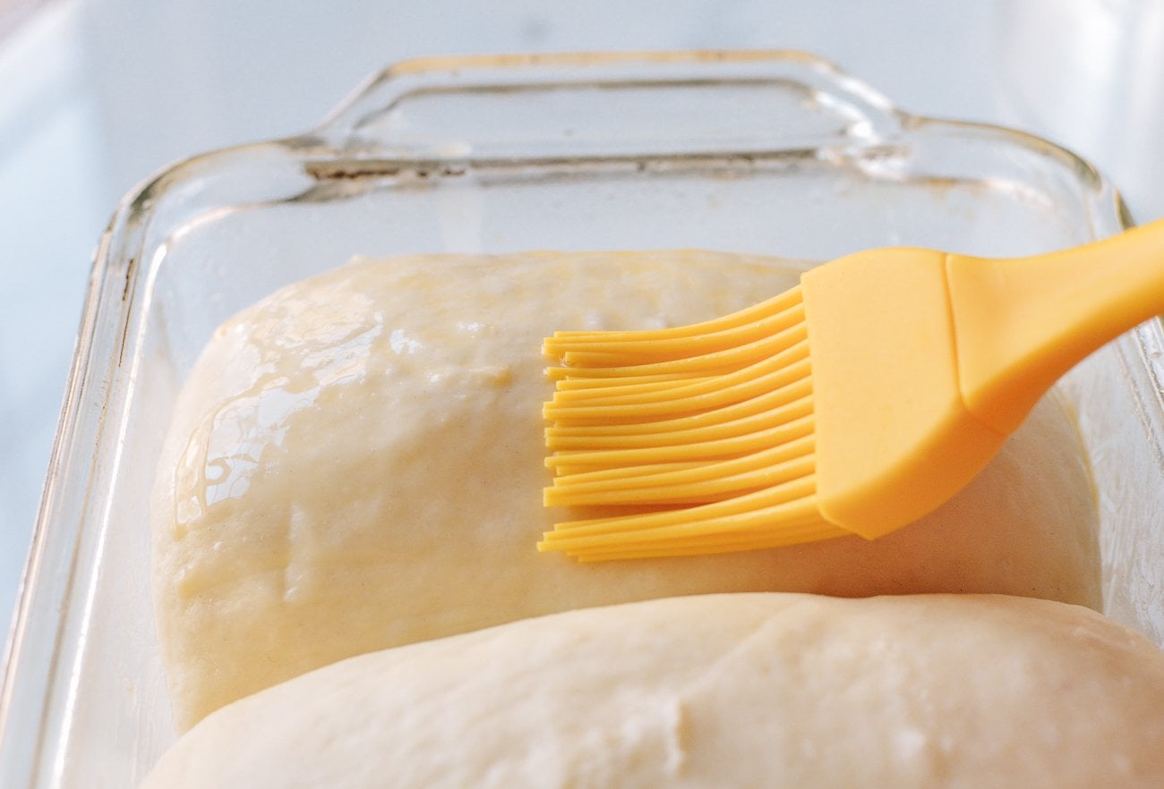 brushing risen dough with egg wash