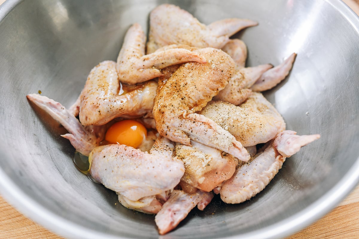 Whole chicken wings with batter and marinade ingredients for Chinese takeout fried wings