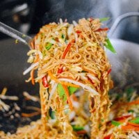 Picking up vegetable ramen noodle stir-fry