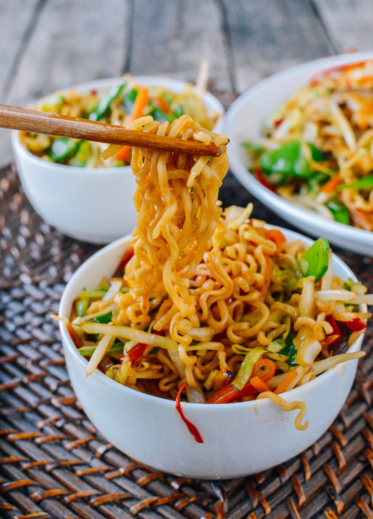 picking up ramen noodles with chopsticks