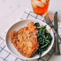 Fried pork chops with greens and iced tea