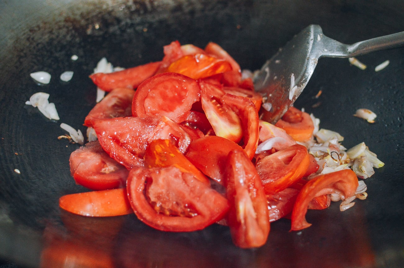 tomato wedges in wok