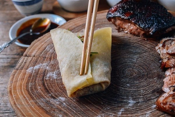 Wrapping duck into mandarin pancakes, by thewoksoflife.com