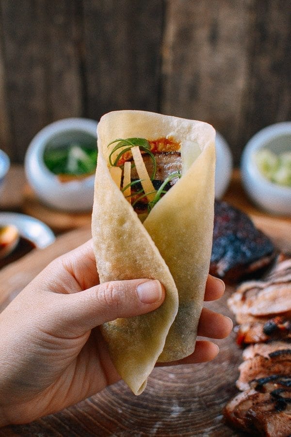 Holding a peking duck pancake, by thewoksoflife.com