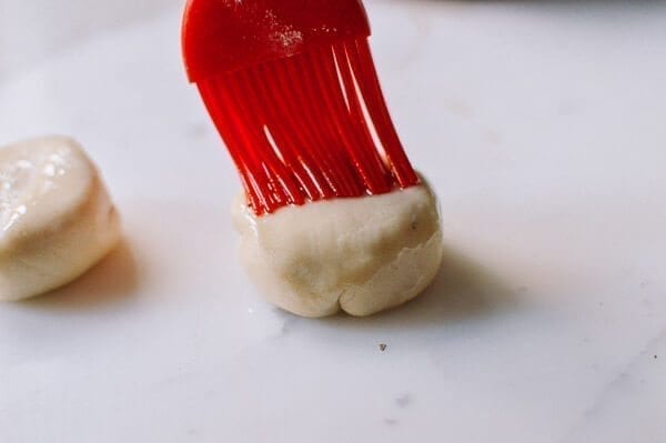 Brushing dough with oil, by thewoksoflife.com