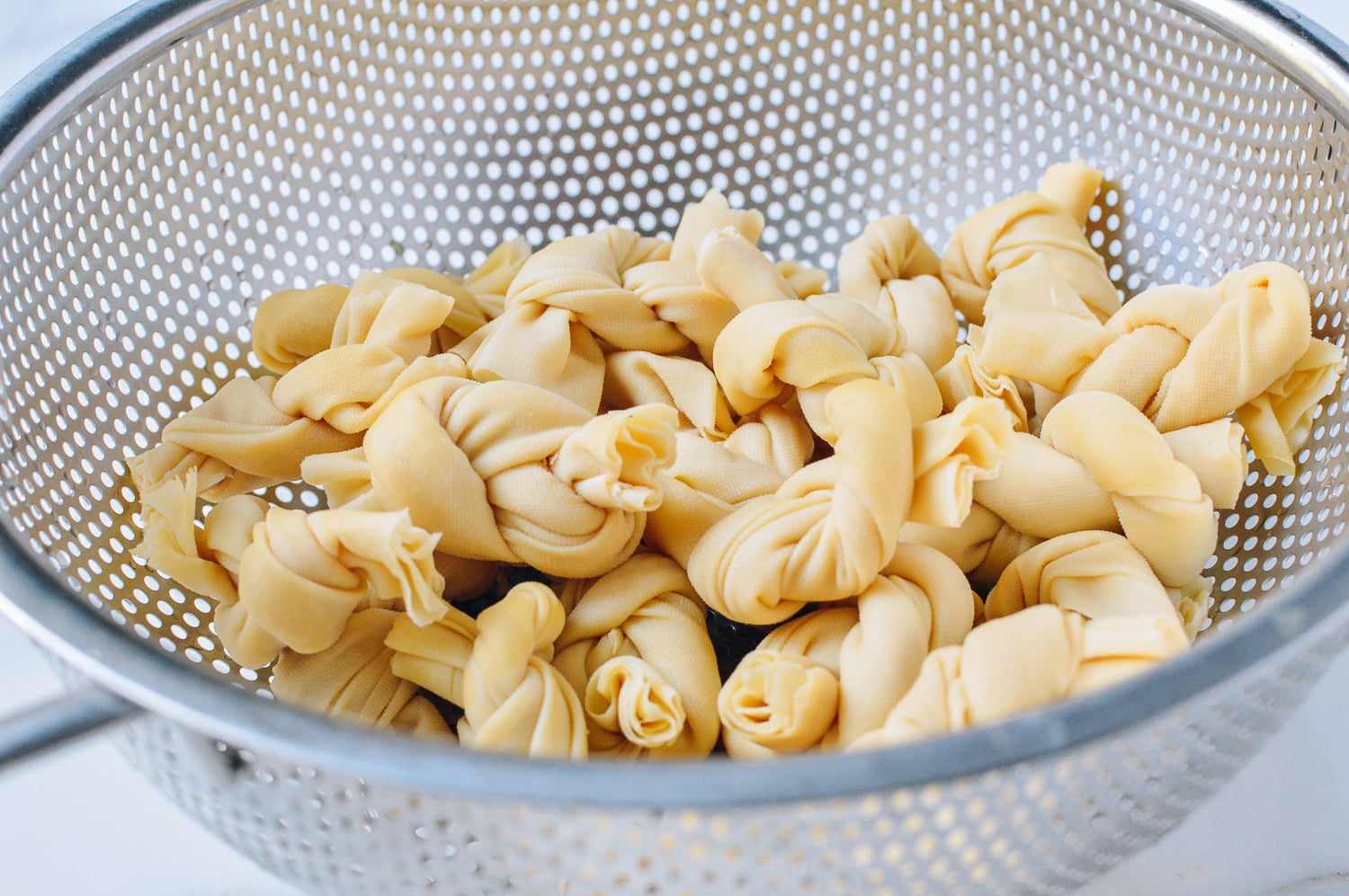 tofu knots in colander