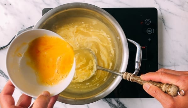 Adding eggs to egg drop soup, thewoksoflife.com