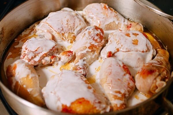 Adding coconut milk to chicken adobo, by thewoksoflife.com
