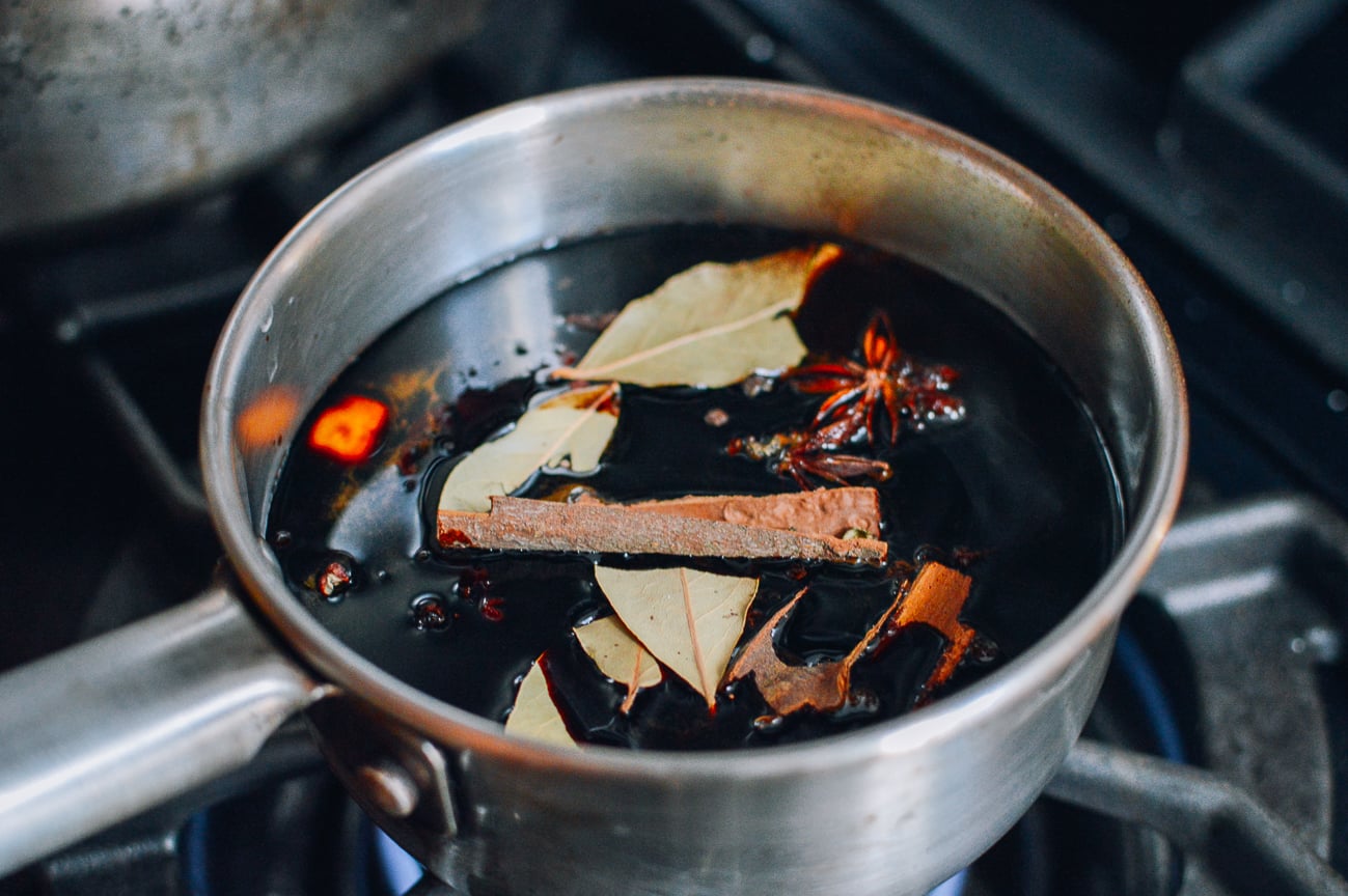 Making the seasoning brine mixture for lap yuk in a small pot
