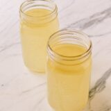 Mason jars of homemade chicken stock