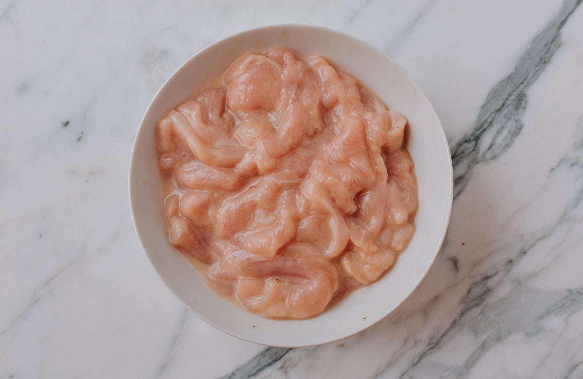 Marinating sliced chicken for stir-fry, thewoksoflife.com