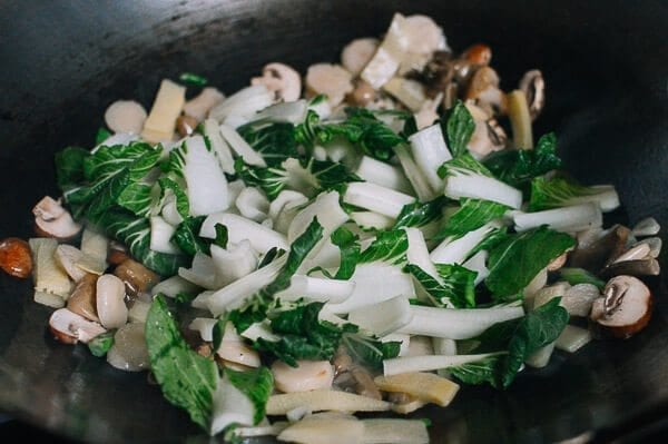 Adding bok choy to stir-fry, by thewoksoflife.com