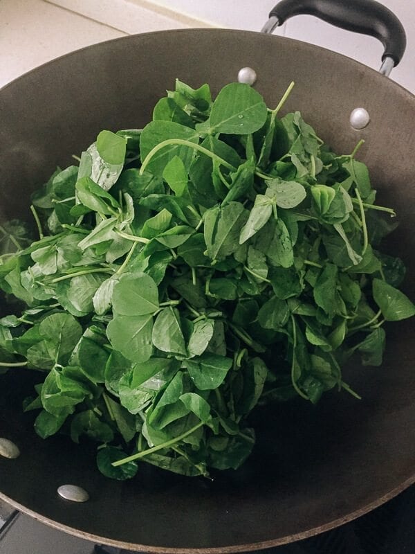 Sautéed Edible Clover (Chao Tou - 炒头) wok with clover, by thewoksoflife.com