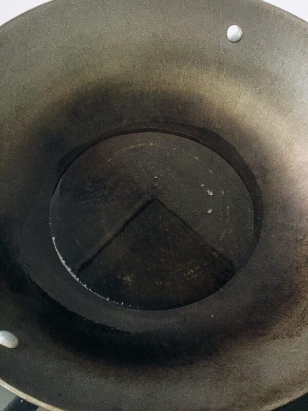 Sautéed Edible Clover (Chao Tou - 炒头) hot wok with oil, by thewoksoflife.com