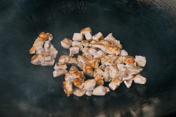 Seared chicken cubes in wok, thewoksoflife.com