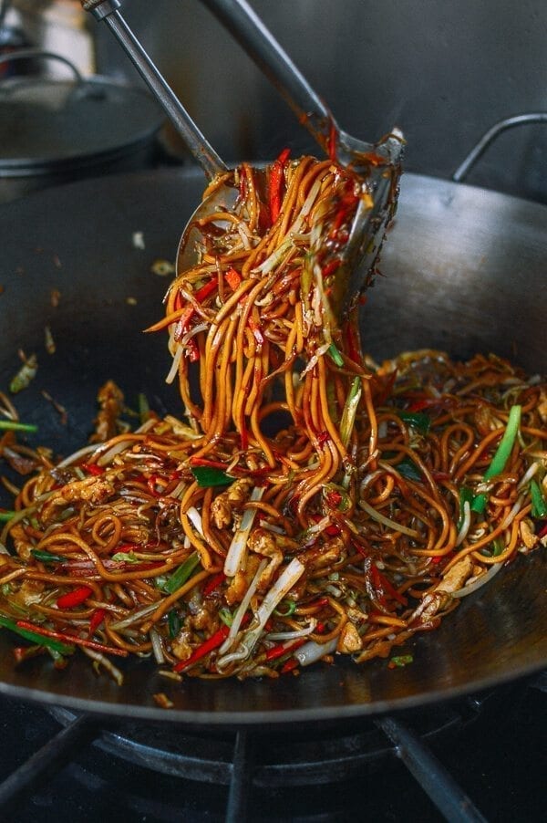Tossing lo mein in a wok, by thewoksoflife.com
