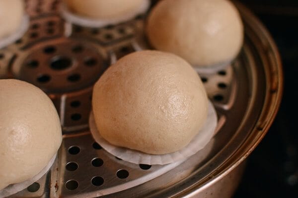 Cantonese Steamed Custard Buns (Nai Wong Bao) in steamer, by thewoksoflife.com