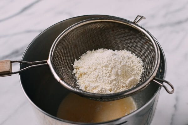 sifting flour for Cantonese Steamed Custard Buns, by thewoksoflife.com