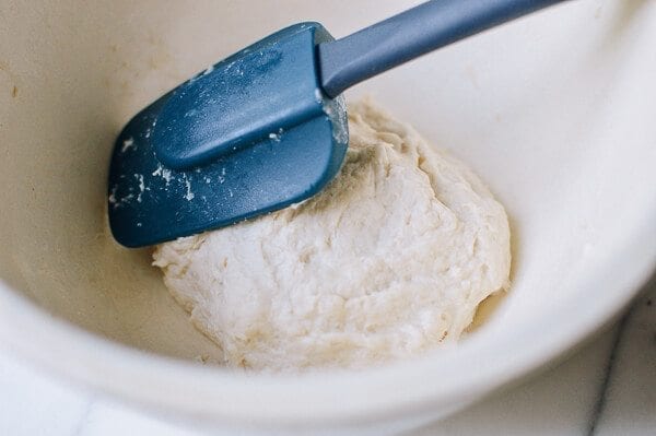 spatula on dough for Jidan Bing by thewoksoflife.com