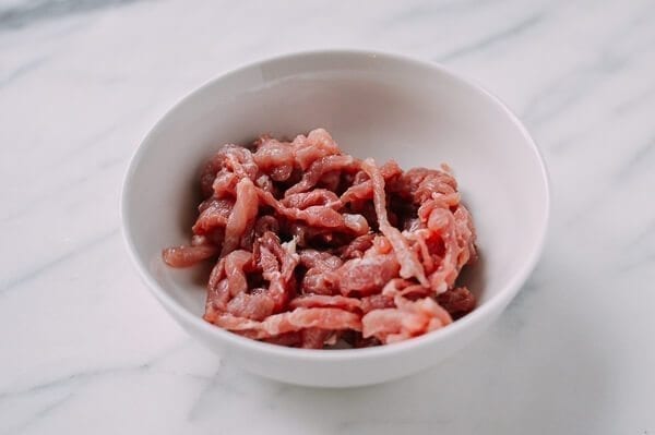 Thinly sliced pork in a bowl, thewoksoflife.com