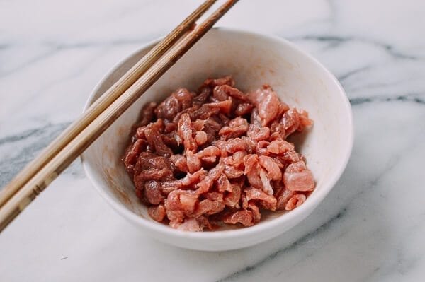 Marinating thinly sliced pork, by thewoksoflife.com