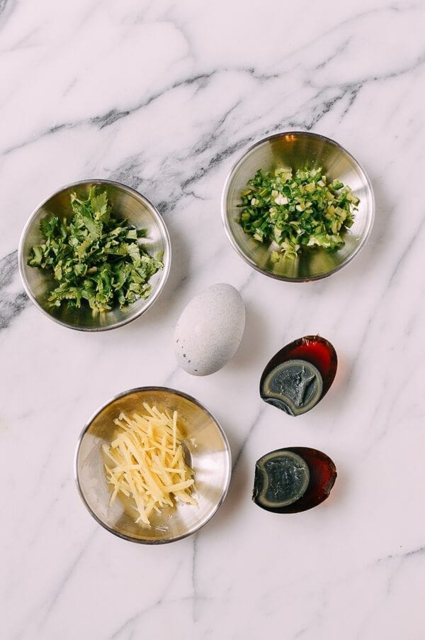 Cilantro, scallions, thousand year old eggs, and ginger, by thewoksoflife.com